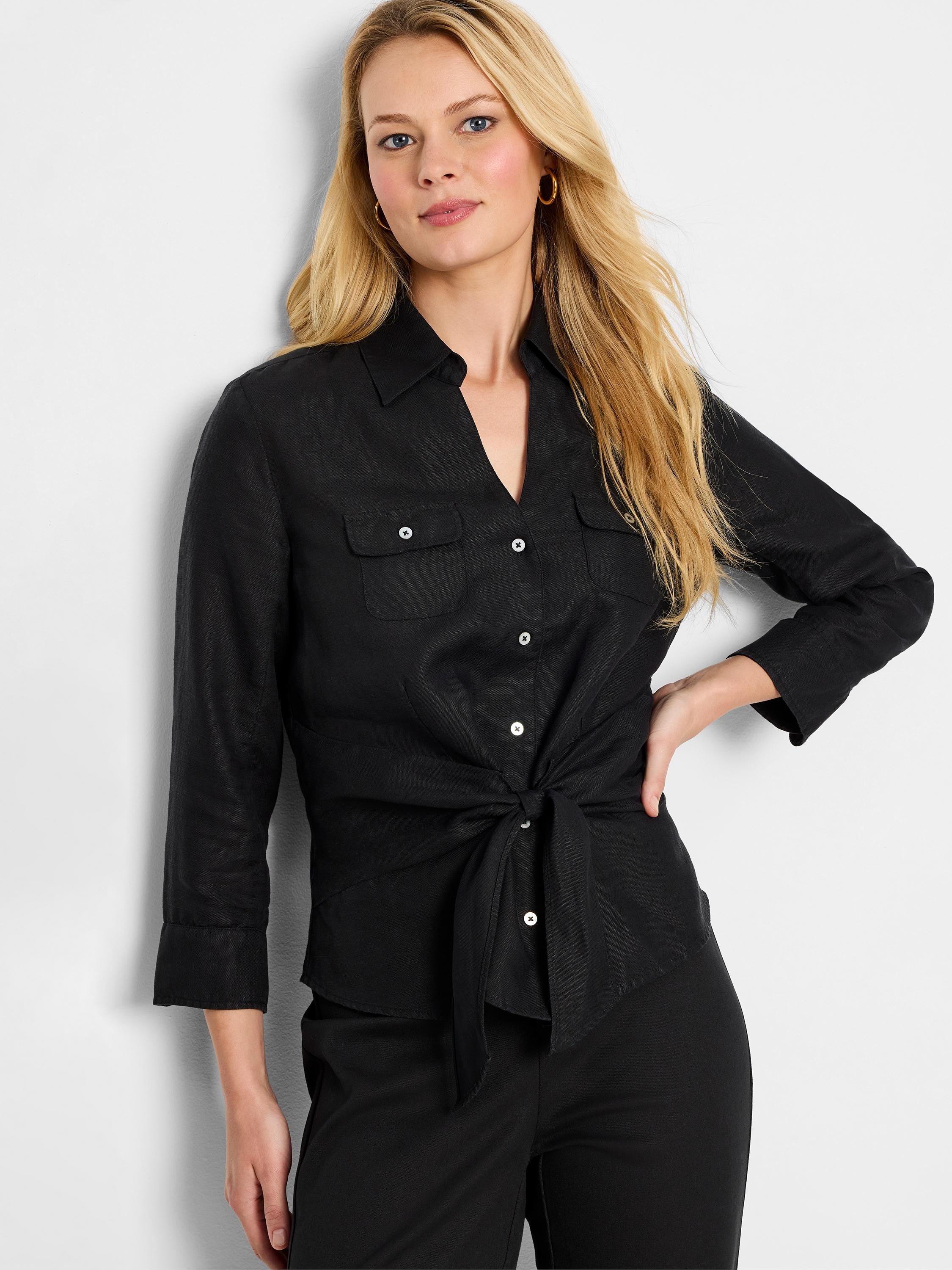 Black linen shirt; 3/4 sleeves, tie front, collared, two chest pockets, button closure.