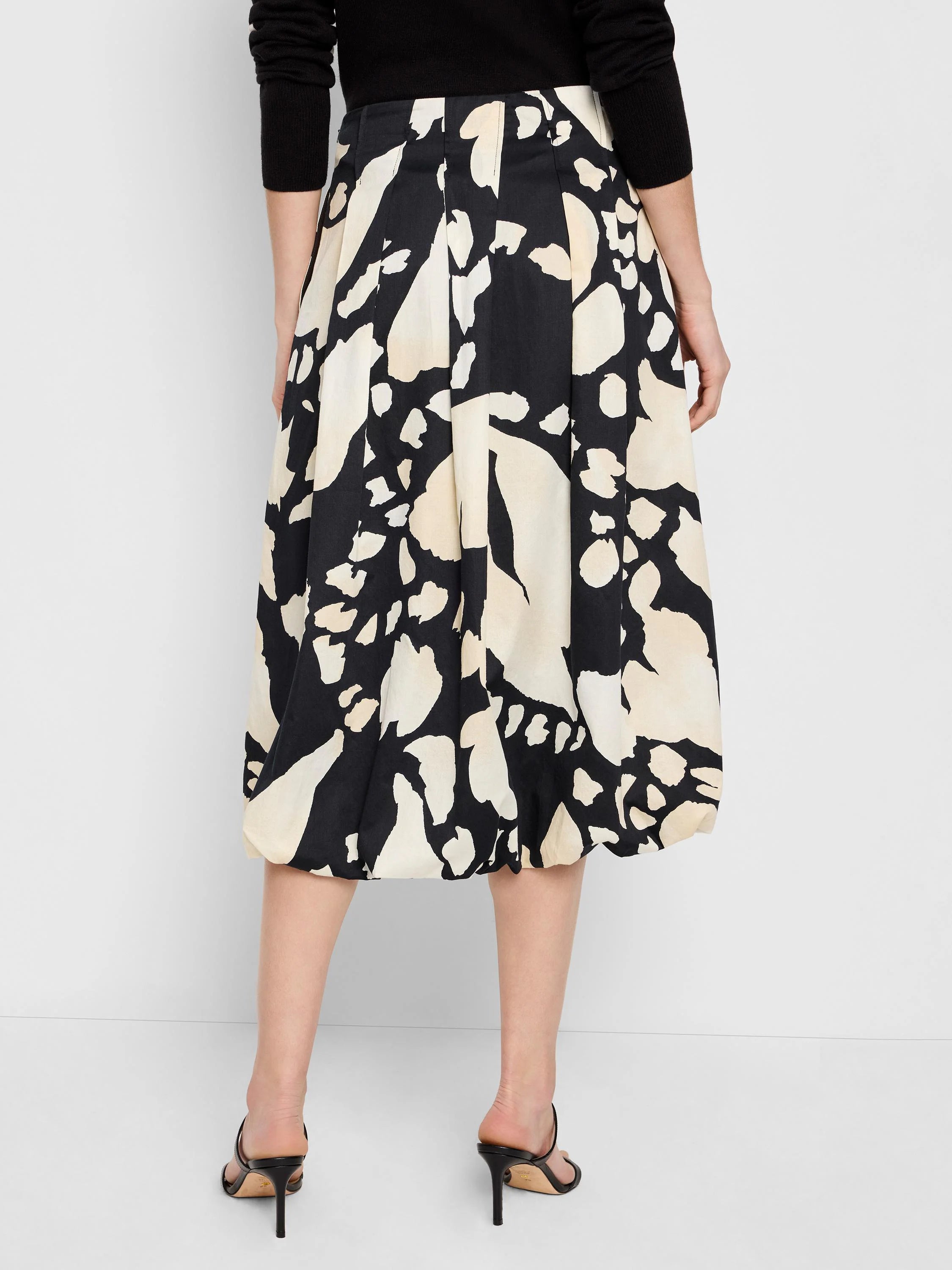 Black midi bubble skirt with beige abstract print.  Pleated design.
