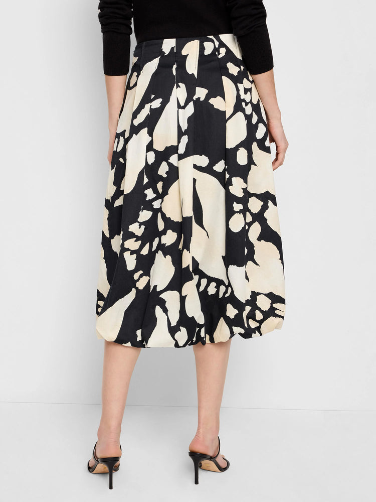Black midi bubble skirt with beige abstract print. Pleated design.
