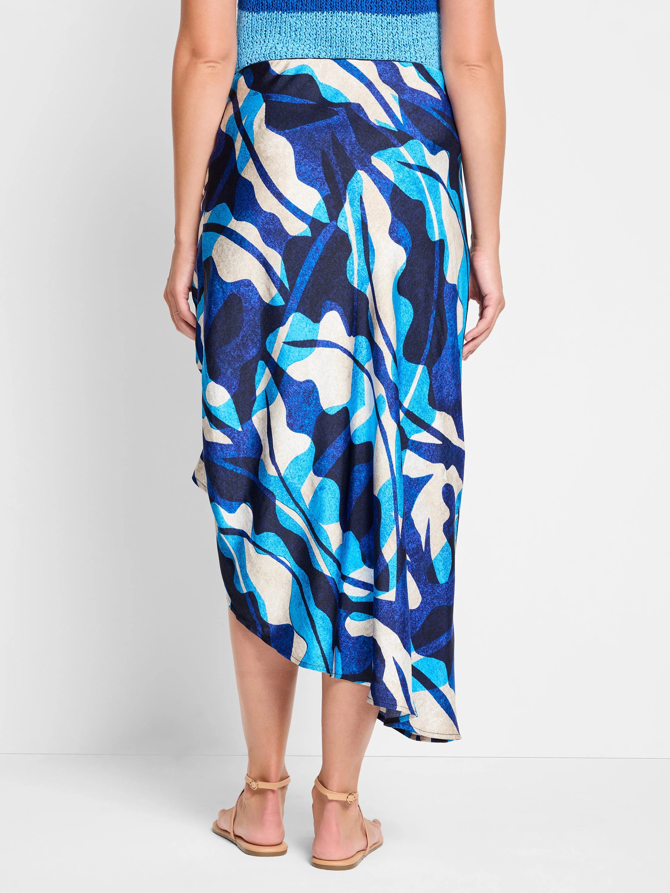 Blue, turquoise, and beige abstract print midi skirt. Asymmetrical hemline.