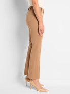 Tan demi boot pants on a model, viewed from the side. Features include a back patch pocket, belt loops, and a slight...