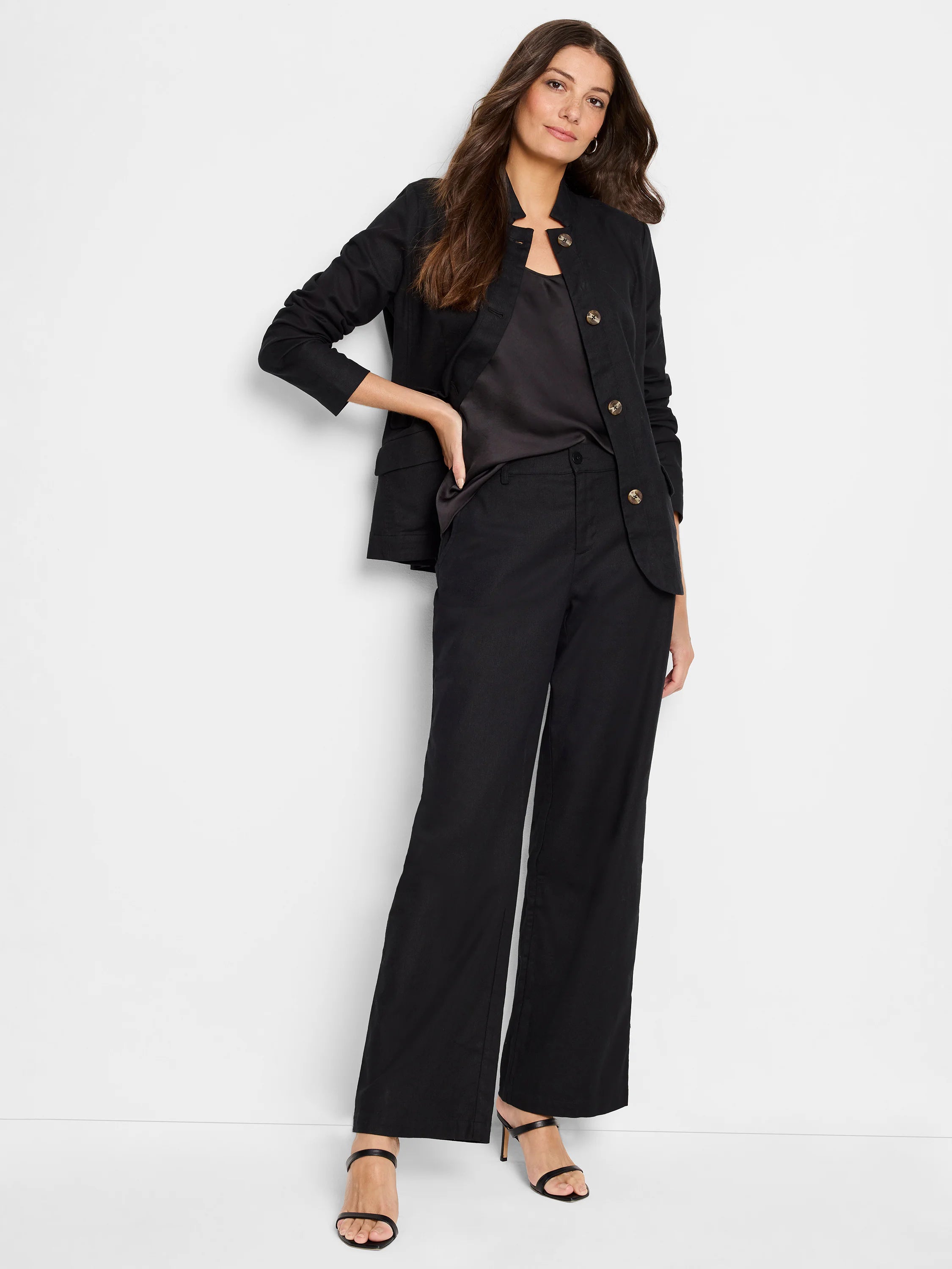 Black linen-cotton wide-leg pants.  Model shown wearing them with a black top and jacket.