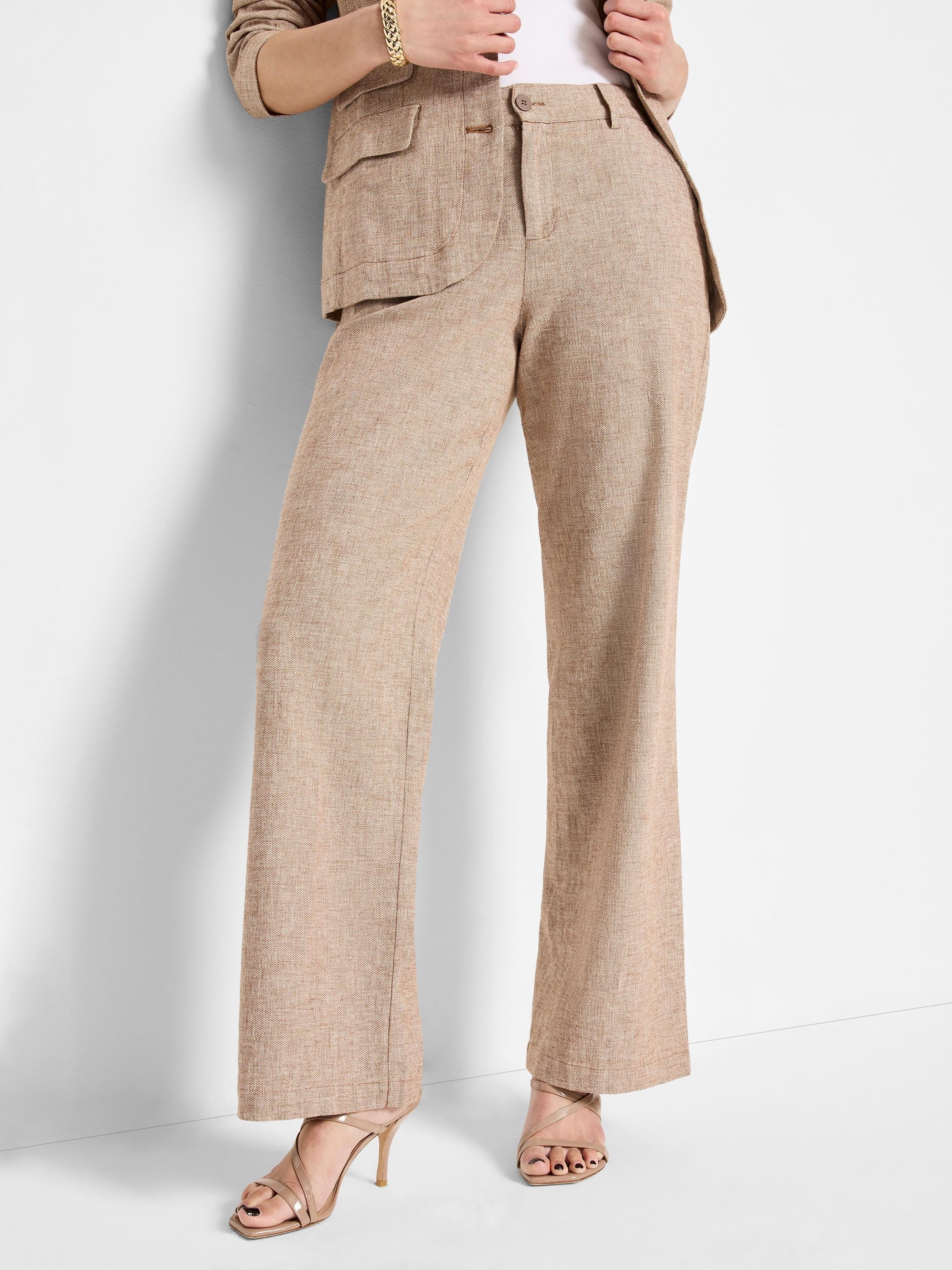 Beige linen-cotton wide-leg pants; textured fabric.