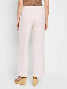 Off-white wide-leg linen cotton pants; back view.  Pockets visible.