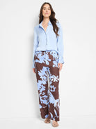 Wide-leg pants; brown background with light blue abstract floral print.