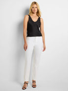 White straight-leg pants with a front fly and flat front.