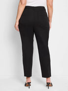 Black straight pants, shown on a model from the back, featuring two back welt pockets and waistband belt loops.