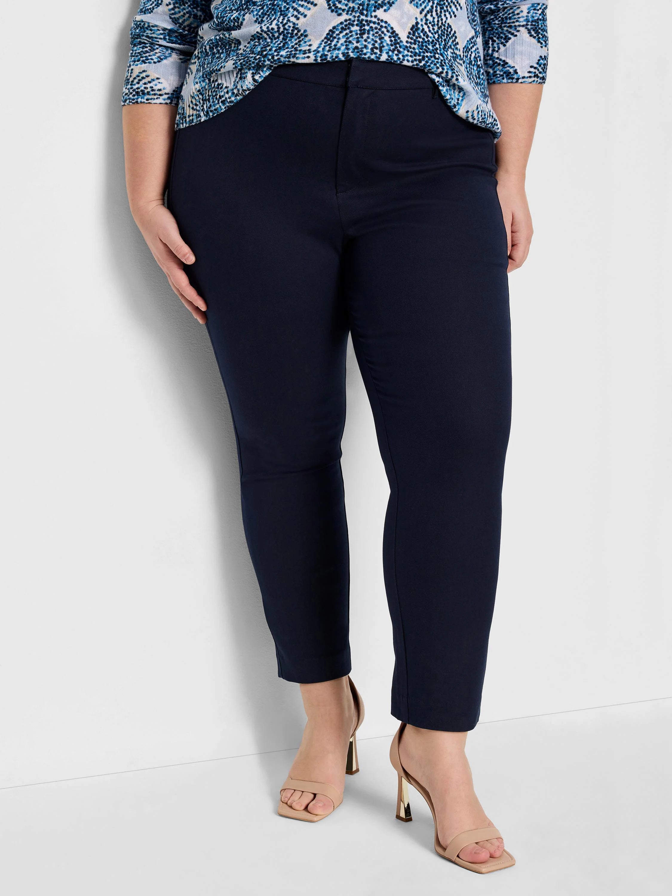 Navy straight-leg pants. Smooth fabric, flat front, ankle-length.