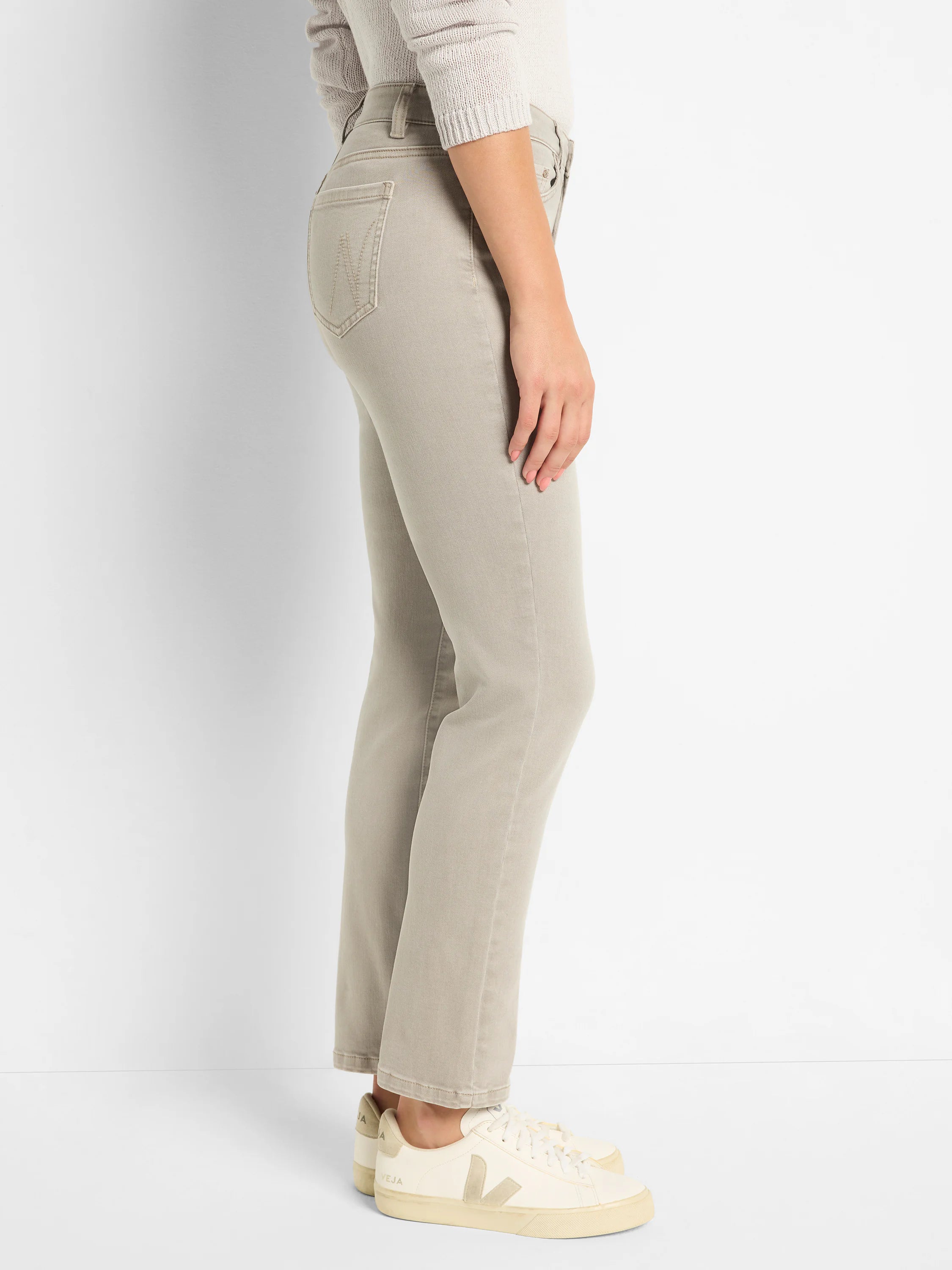 Light taupe straight ankle jeans. Features a fitted thigh, straight leg, and ends above the ankle.