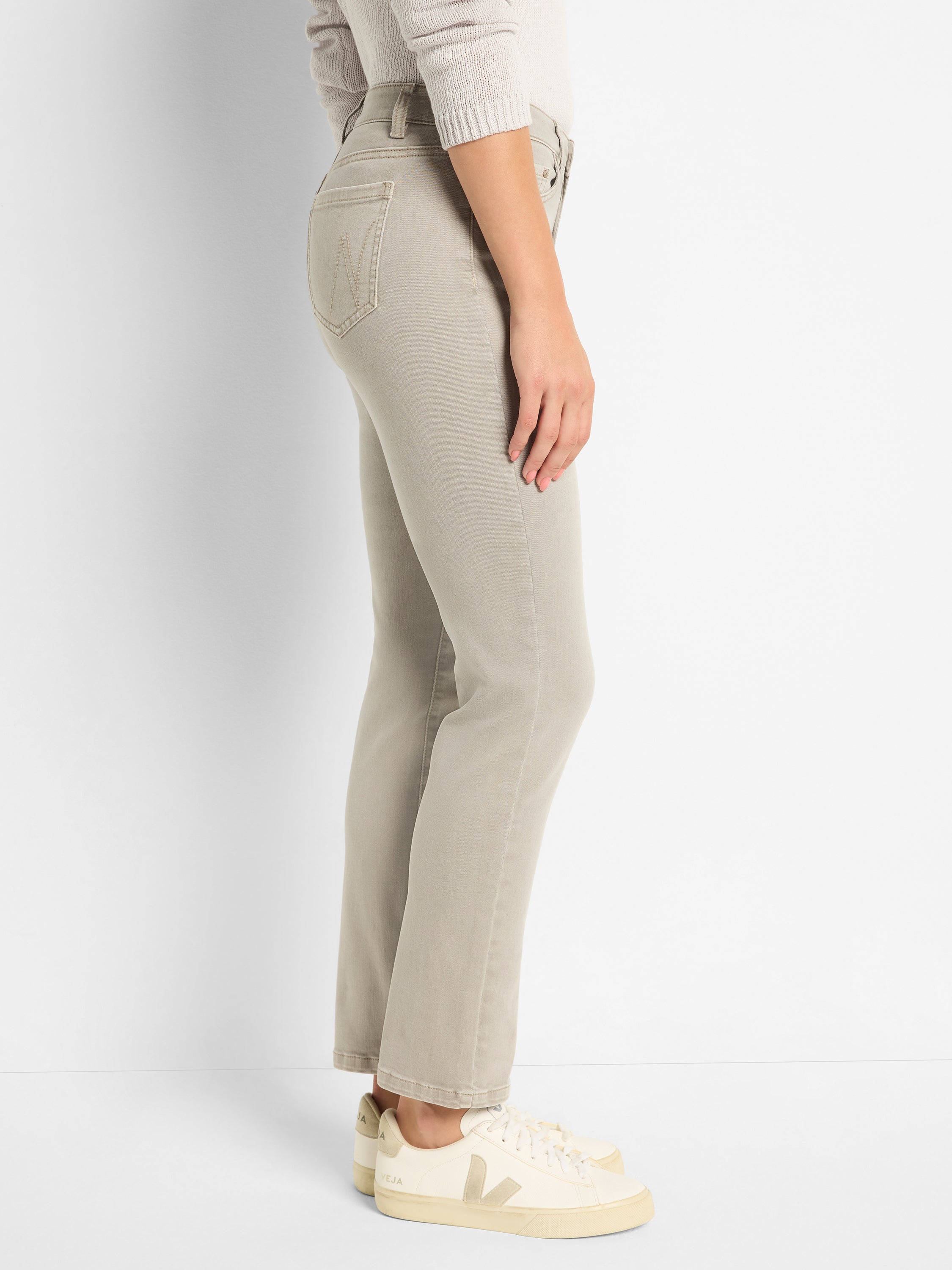 Cropped taupe jeans with a high-waisted, slim-straight fit feature classic five-pocket denim styling.