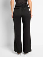 Black wide-leg pants with a front slit, elastic waistband, and back pockets.