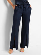 Dark navy blue satin pants with front slits and drawstring waist.