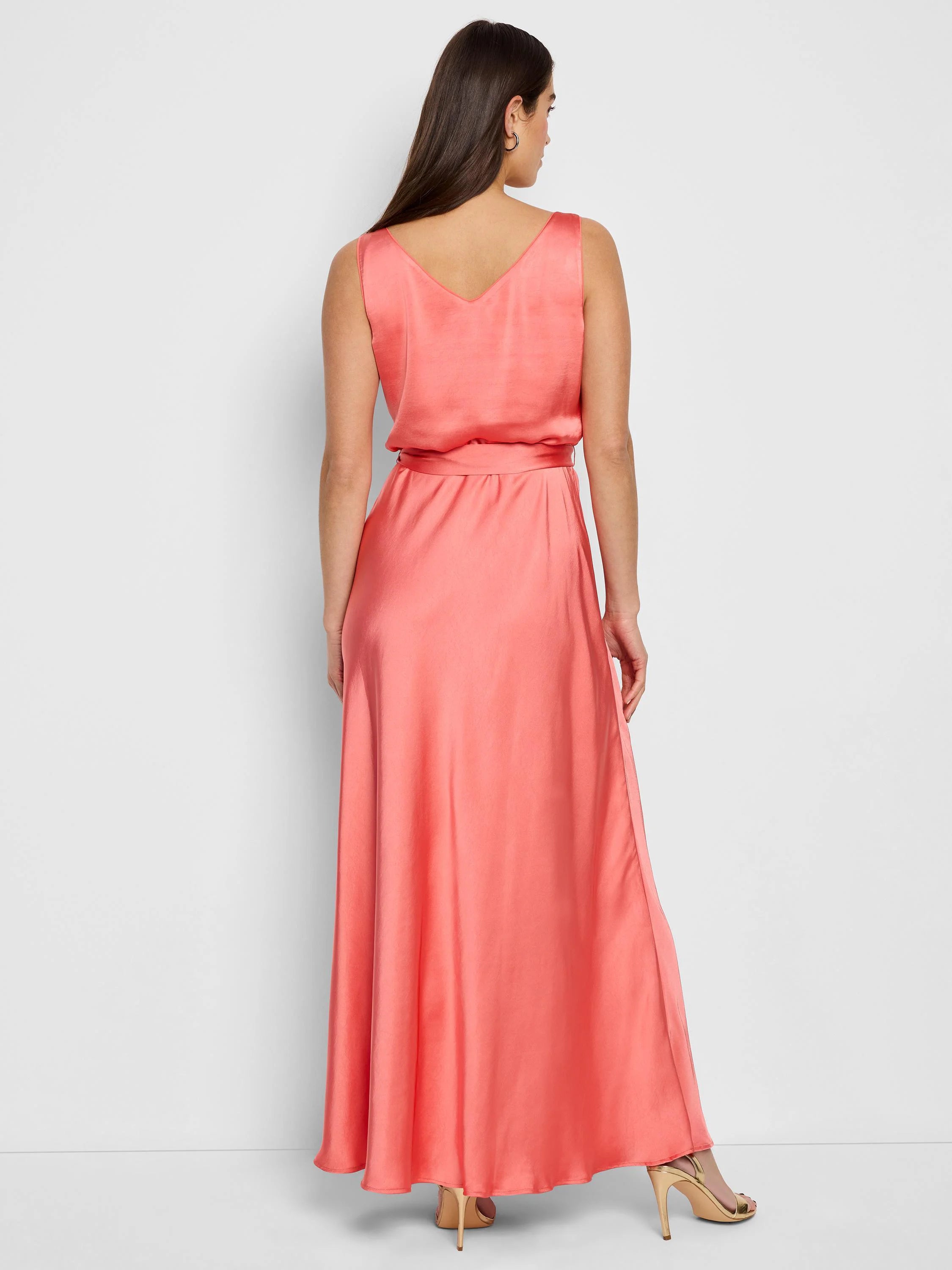Coral pink maxi dress, sleeveless, V-neck, belted waist, A-line skirt.