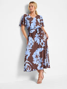 Brown midi dress with light blue floral print, V-neck, short flutter sleeves, and a self-tie belt.