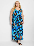 Maxi dress, sleeveless, v-neck. Blue, teal, brown, and black abstract print on black background.  Belted waist.
