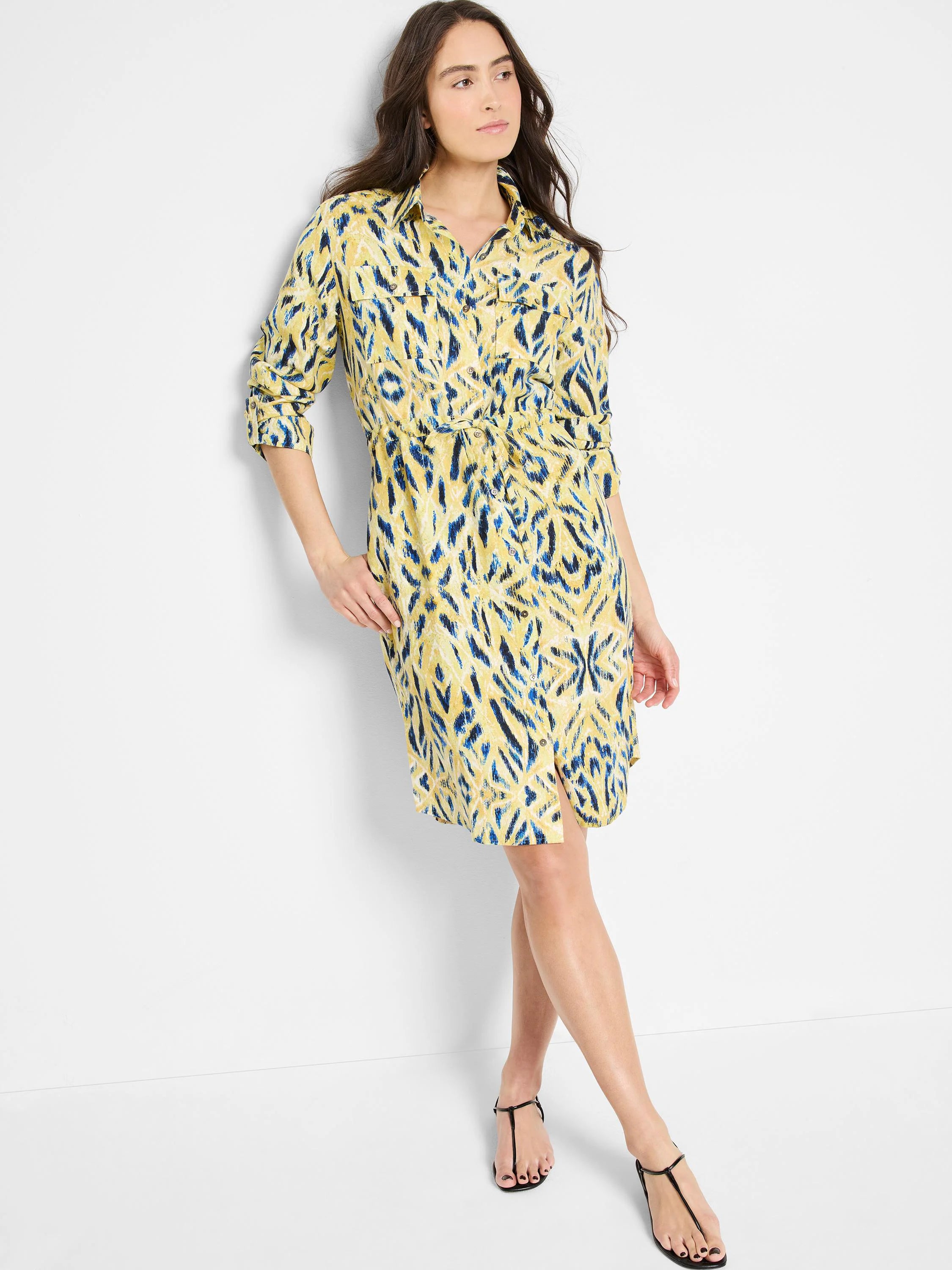 Yellow shirt dress with blue & dark blue abstract print, button front,  tie waist, and knee length.
