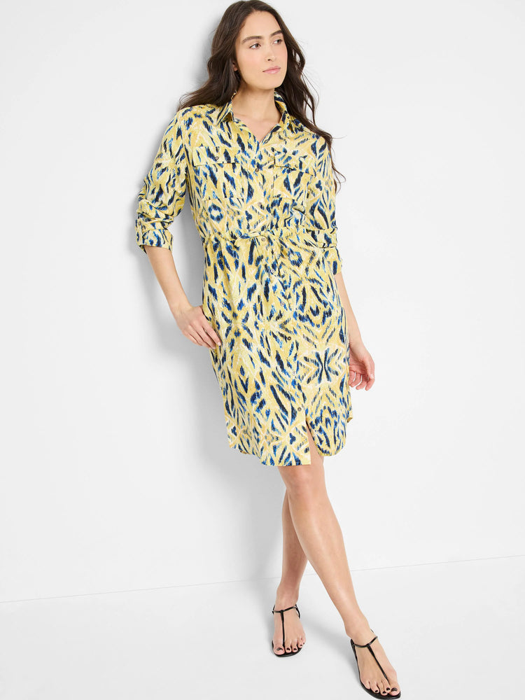 Yellow shirt dress with blue & dark blue abstract print, button front, tie waist, and knee length.