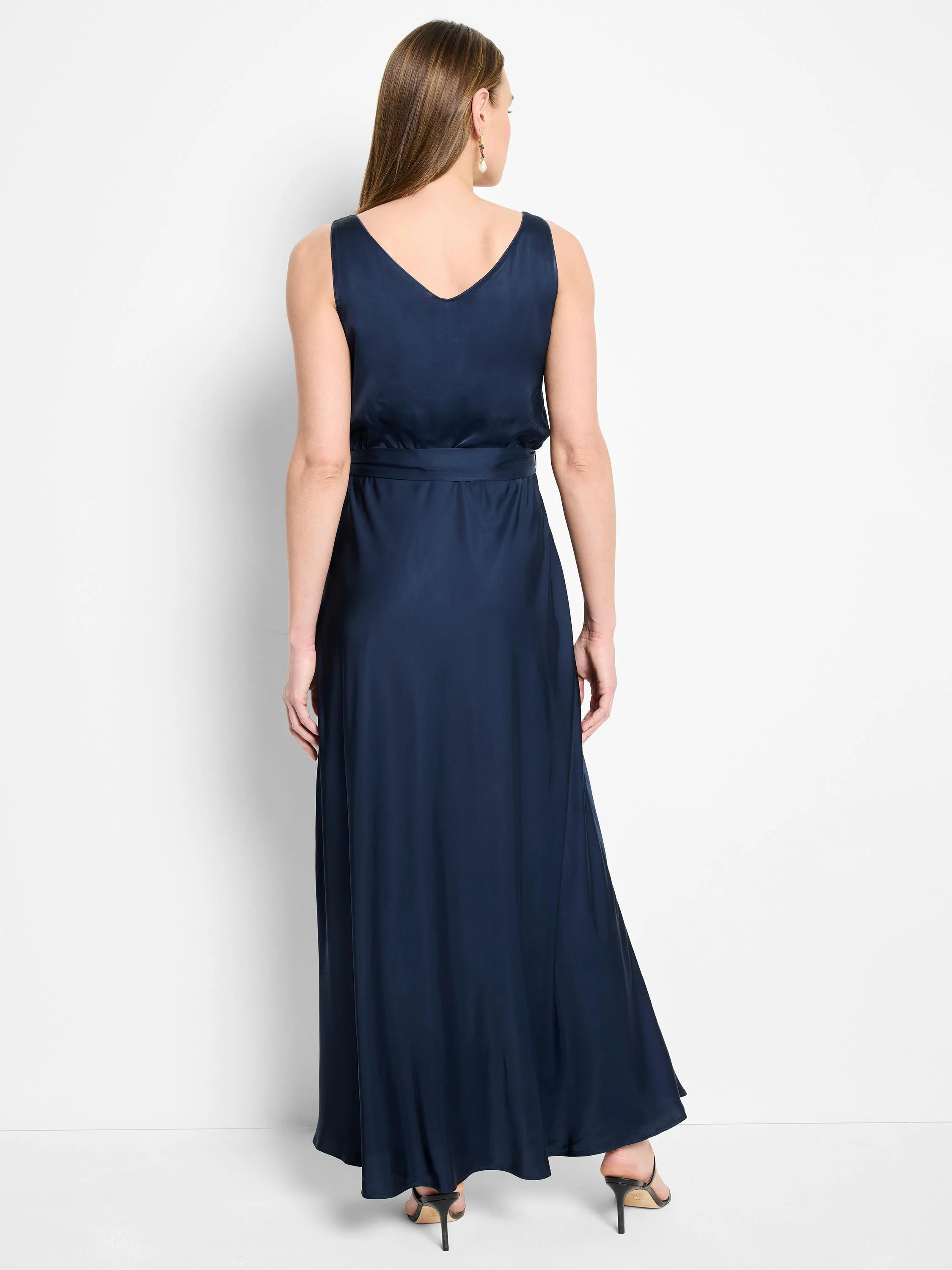 Navy blue maxi dress, sleeveless, V-neck, belted waist, A-line skirt.