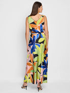 Black maxi dress with large abstract floral print in blue, orange, pink, and lime green. Sleeveless, V-neck.