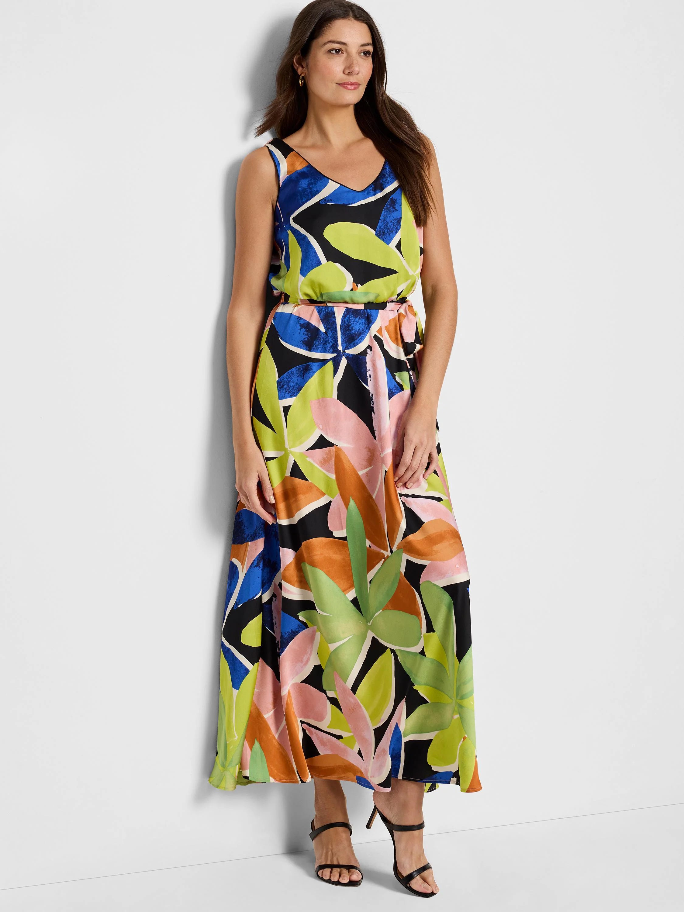 Maxi dress, sleeveless, V-neck.  Black background with large lime, pink, orange, and blue leaf print.  Belted waist.