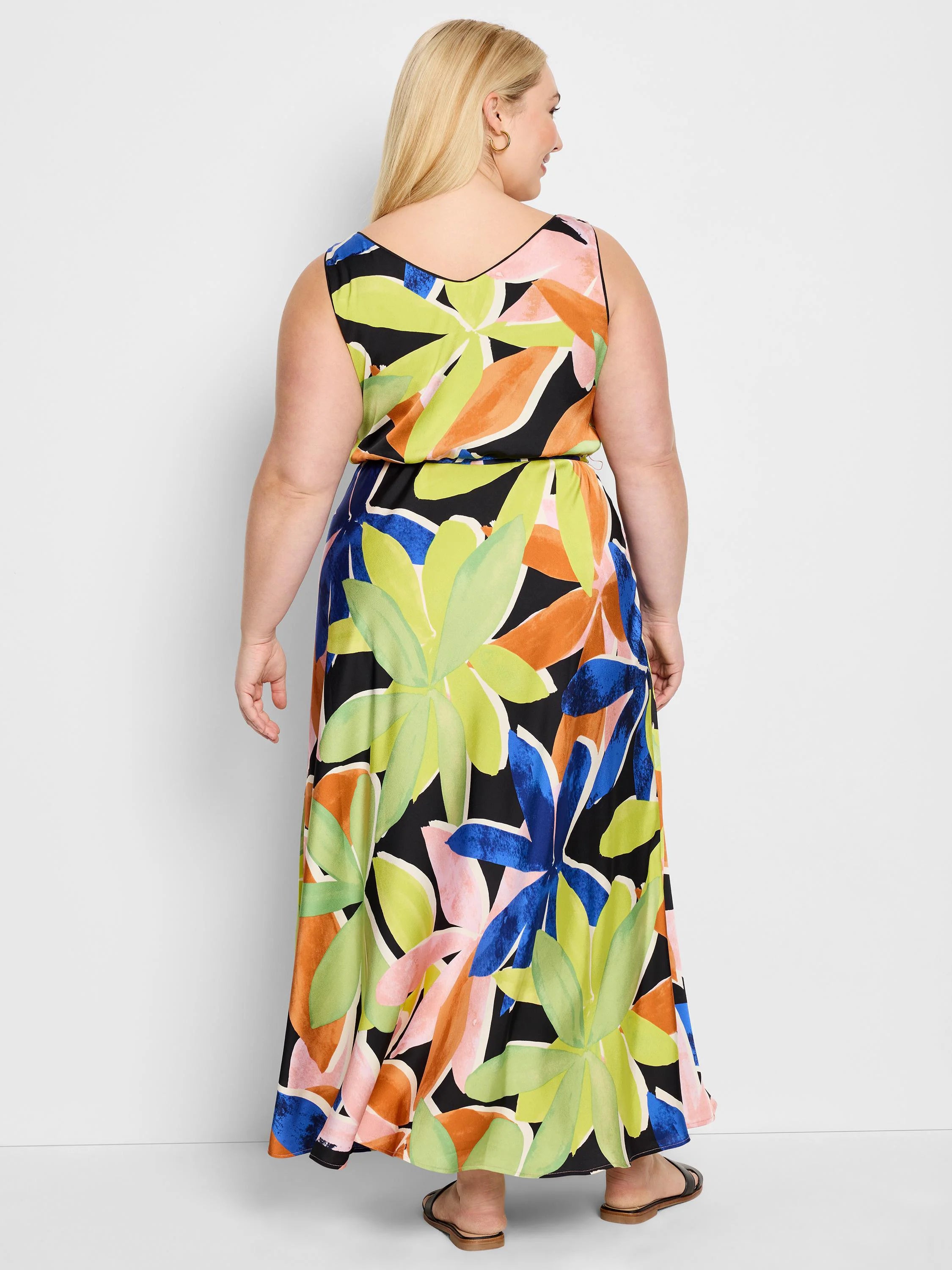 Black sleeveless maxi dress with lime green, orange, pink & blue abstract floral print.