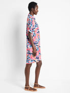 Pink, blue, and peach abstract floral print shirt dress. Short sleeves, collared. Knee-length.
