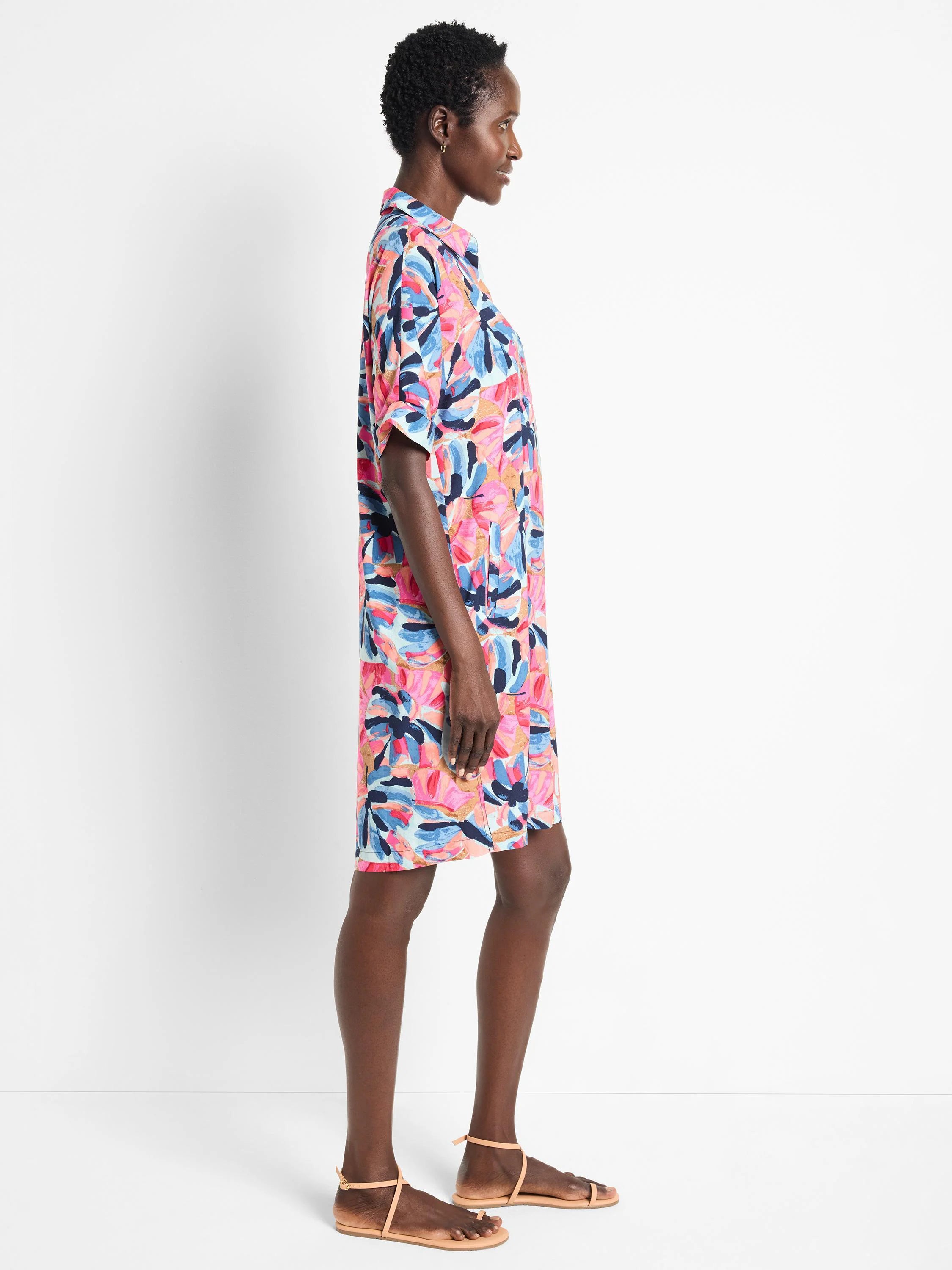 Pink, blue, and peach abstract floral print shirt dress. Short sleeves, collared. Knee-length.