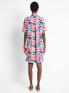 Short, collared shirt dress; pink, blue, and tan abstract floral print.  Short sleeves.