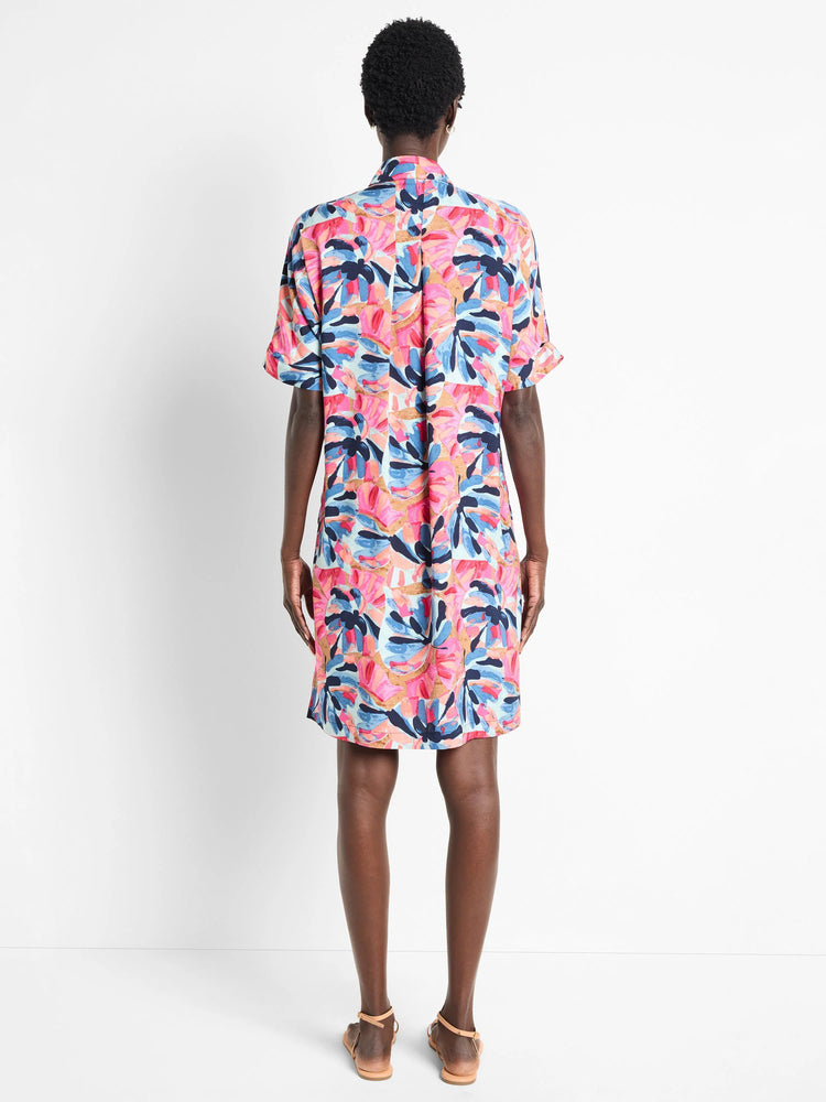Short, collared shirt dress; pink, blue, and tan abstract floral print. Short sleeves.