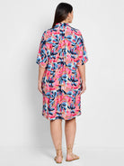 Pink, blue, and peach abstract floral print knee-length shirt dress; short sleeves.