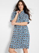 Blue and brown patterned shirt dress, short sleeves, collared.