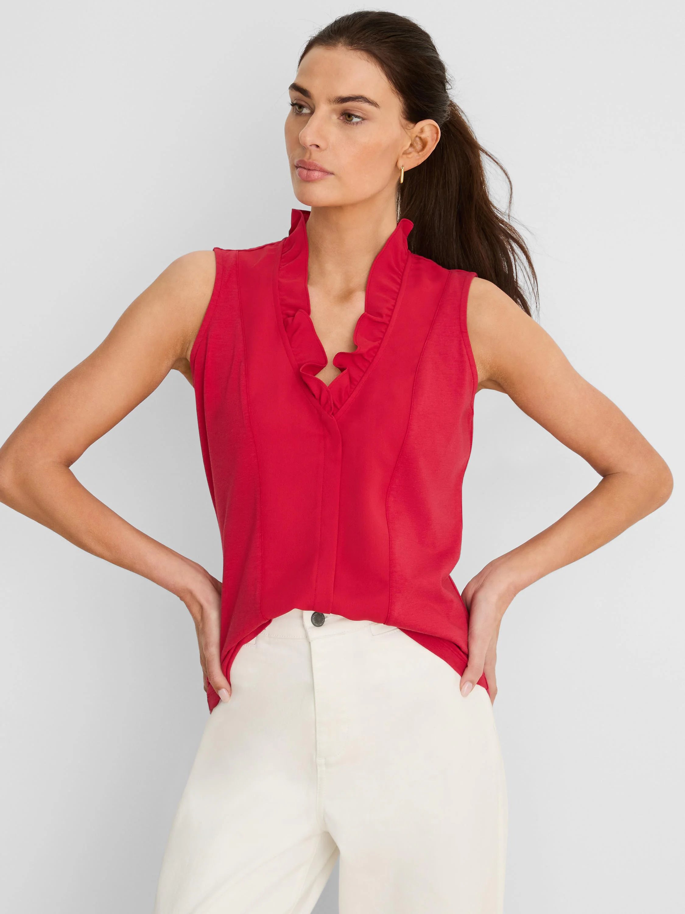 Red sleeveless tank with ruffled V-neck collar.