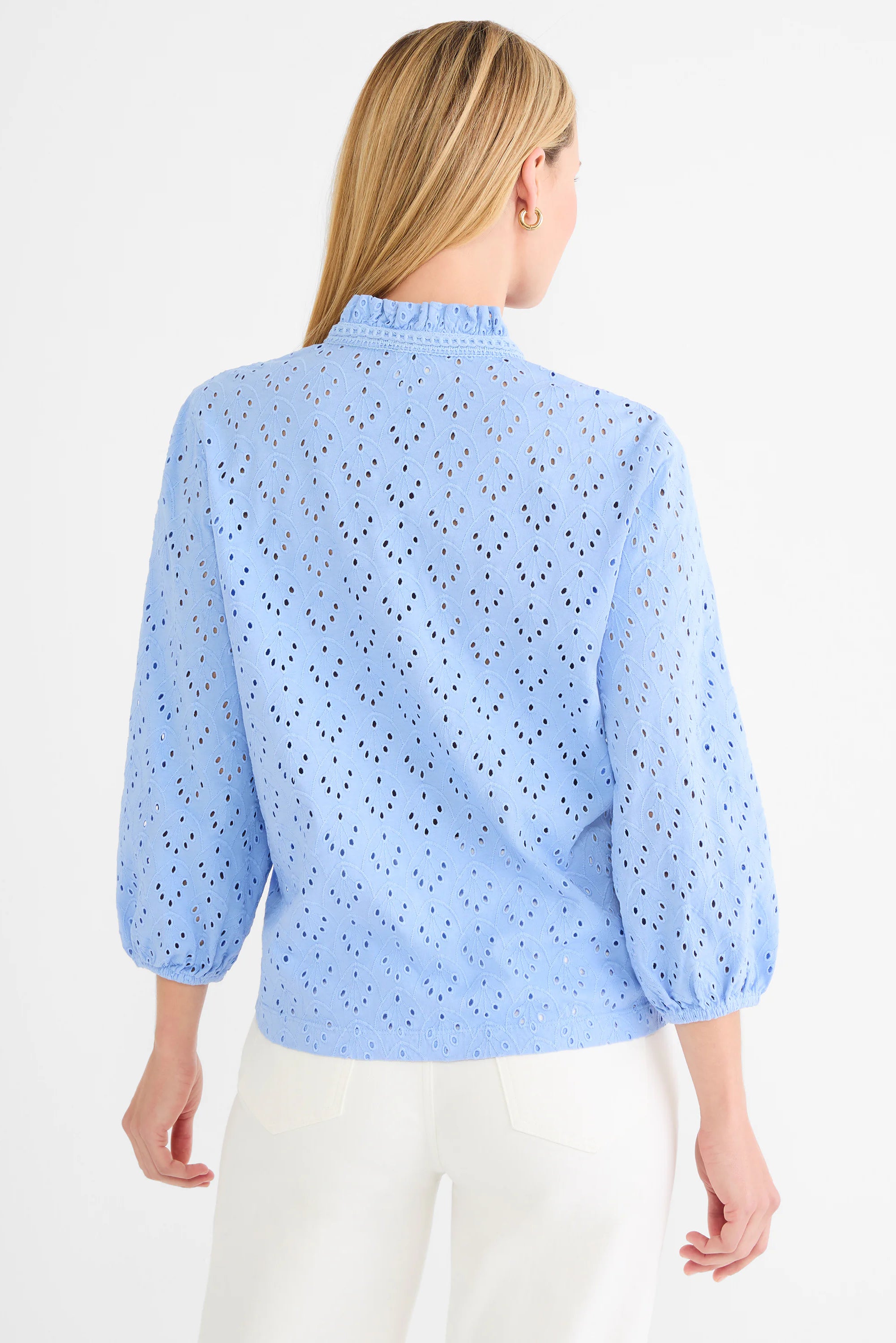 Light blue knit eyelet top with ruffle neck and 3/4 puff sleeves.