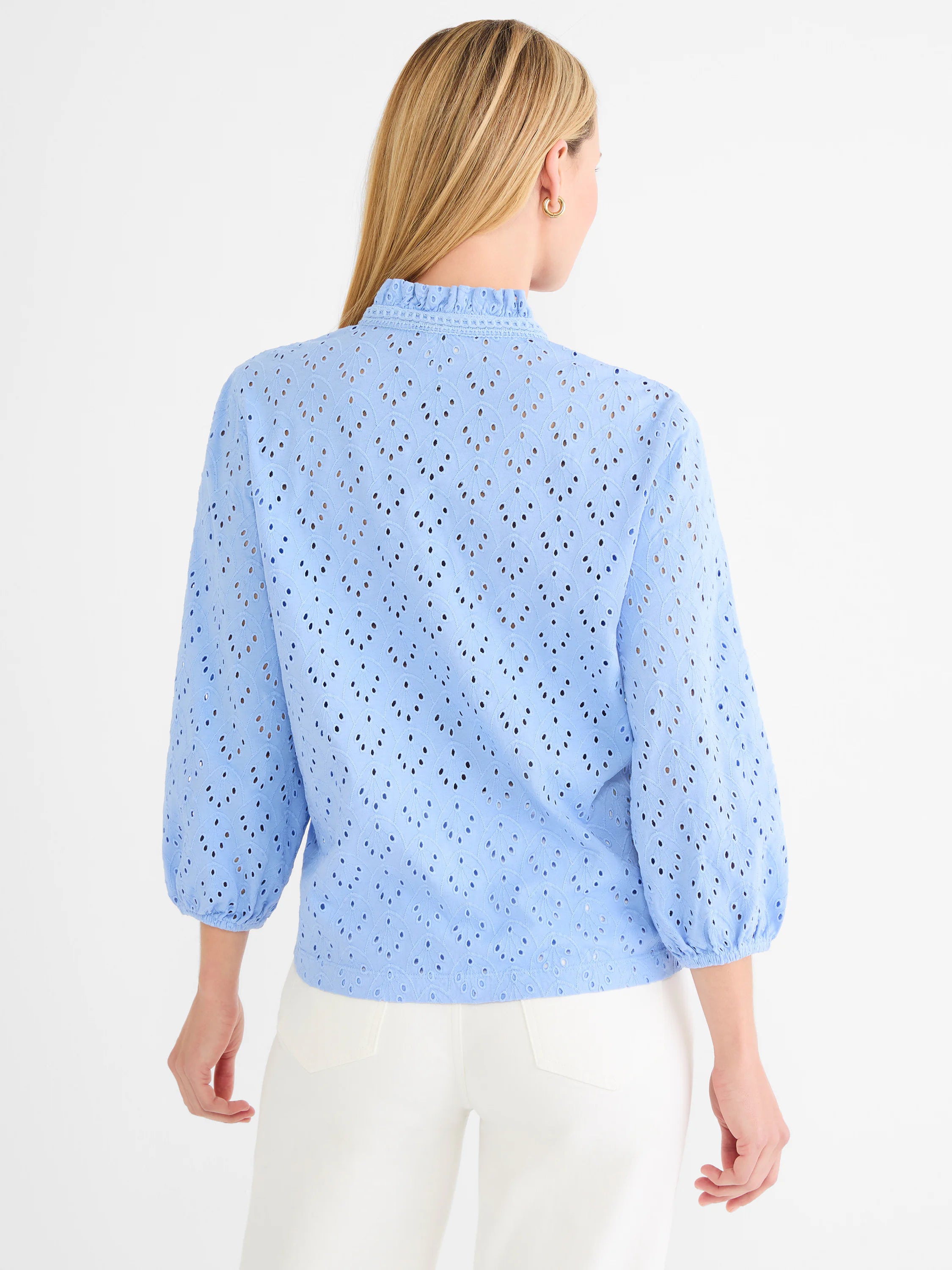 Light blue knit eyelet top with ruffle neck and 3/4 puff sleeves.