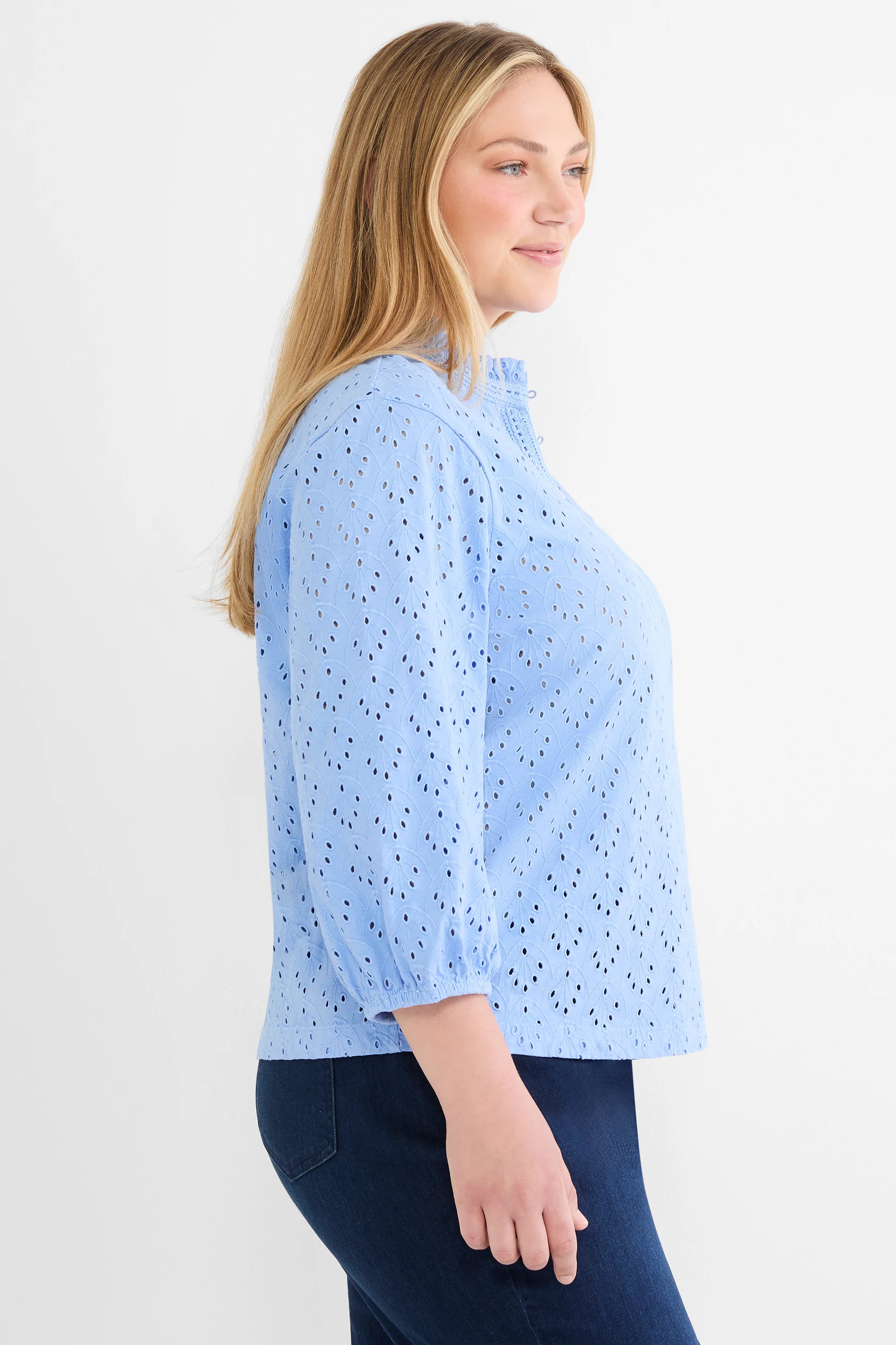 Light blue knit eyelet top with ruffle neck, 3/4 sleeves, and leaf-shaped perforations.