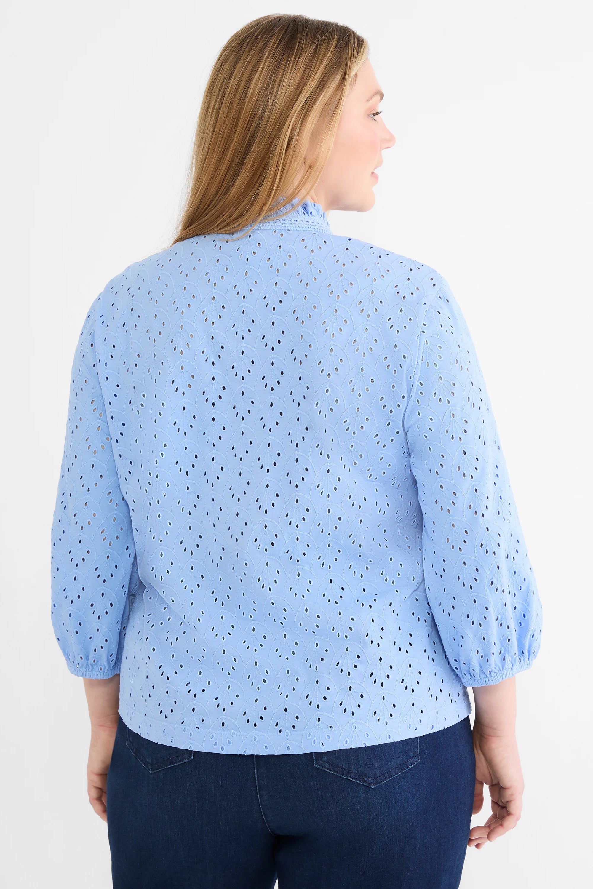 Periwinkle eyelet top with leaf pattern, ruffle mock neck, and 3/4 puff sleeves with gathered cuffs.