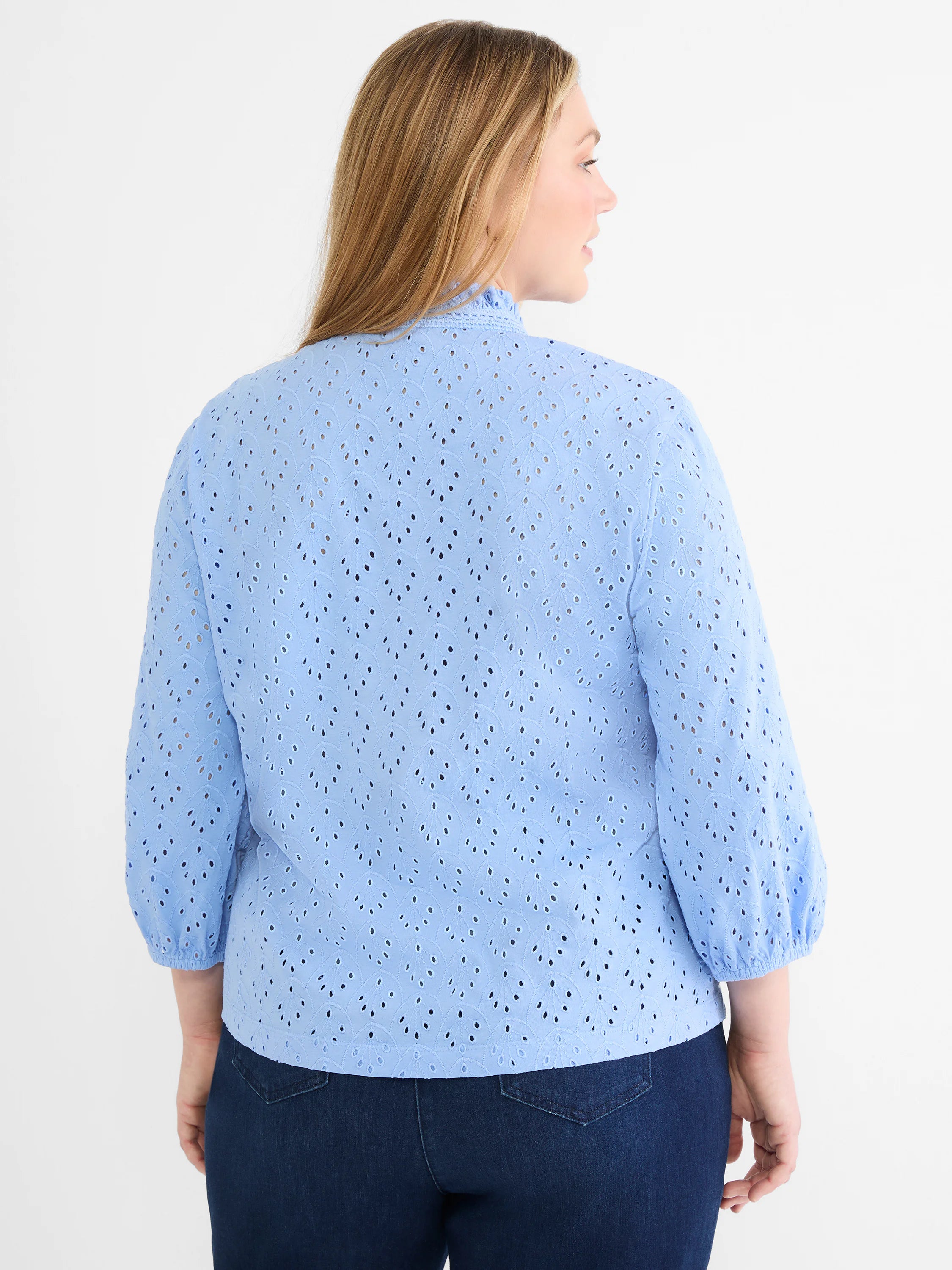 Periwinkle eyelet top with leaf pattern, ruffle mock neck, and 3/4 puff sleeves with gathered cuffs.