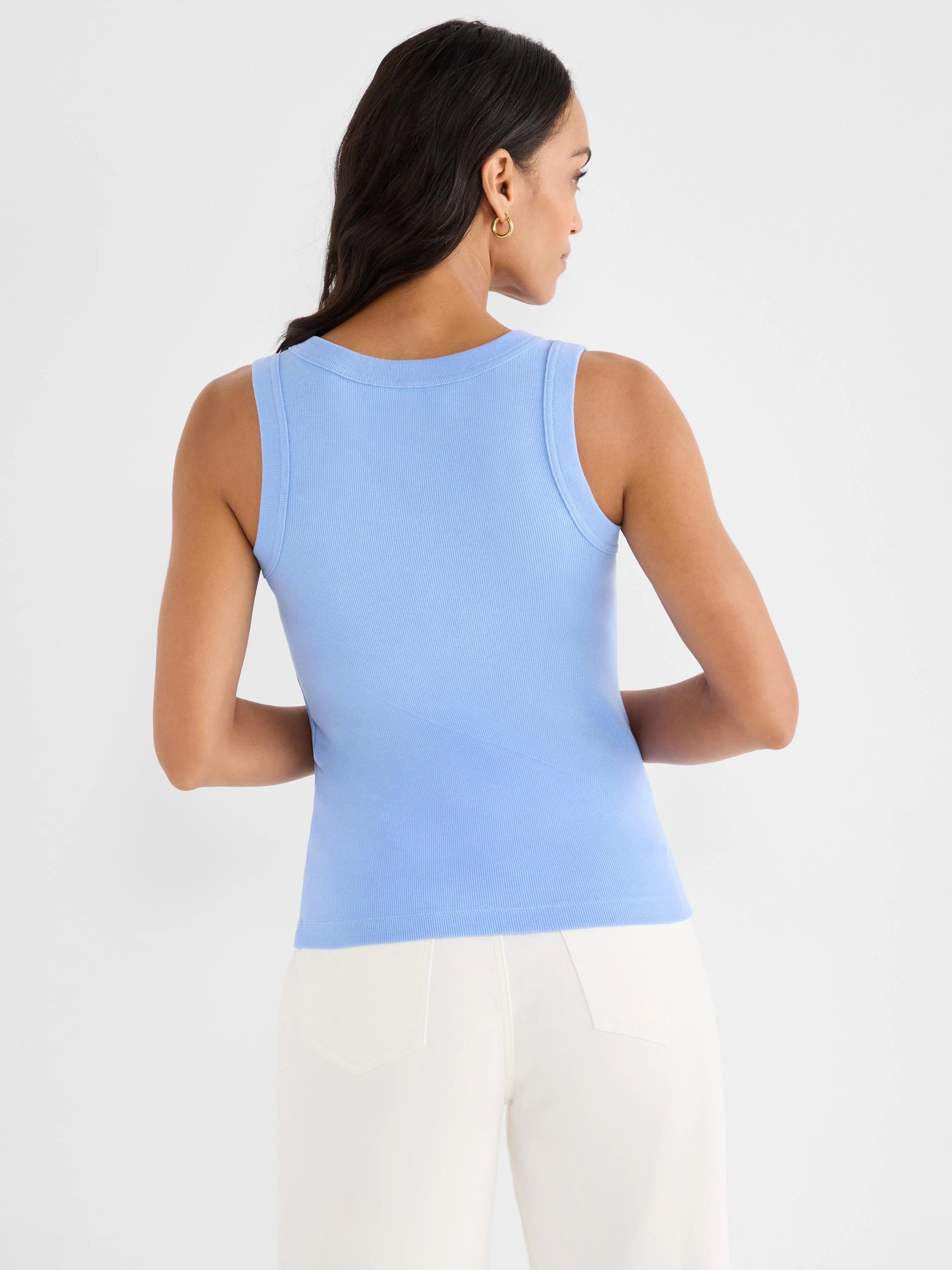 Light blue ribbed knit scoop tank. Fitted, back view on model.