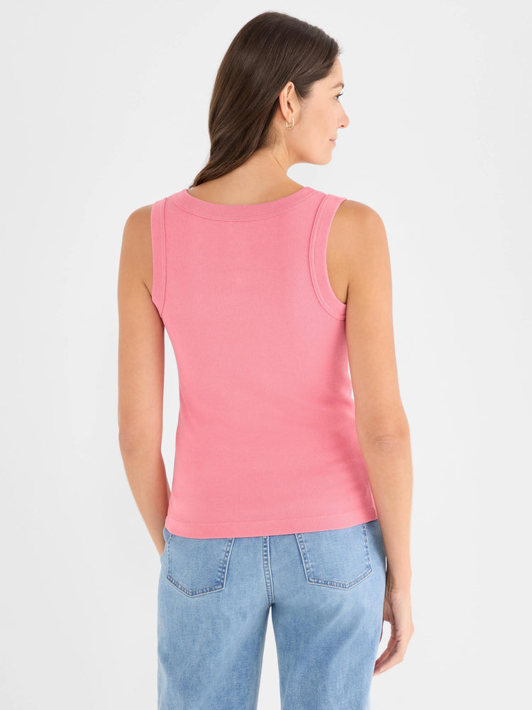 Pink rib knit tank top with scoop back, worn by a model, seen from behind.