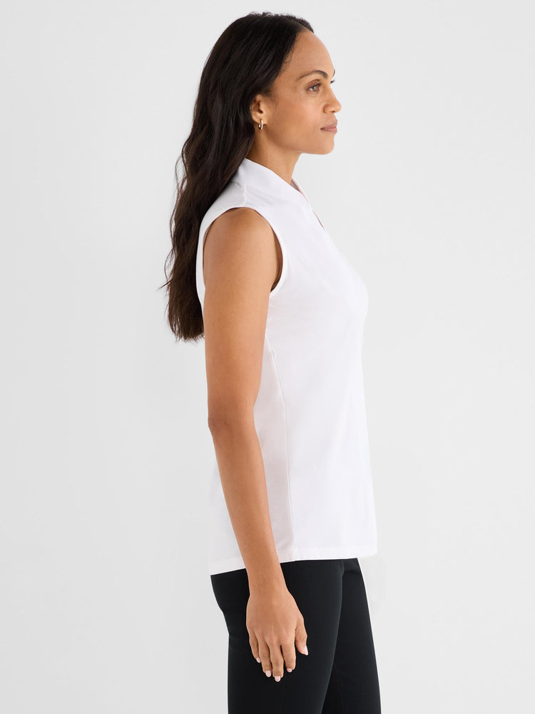 White sleeveless blouse featuring a stand collar and a relaxed silhouette.