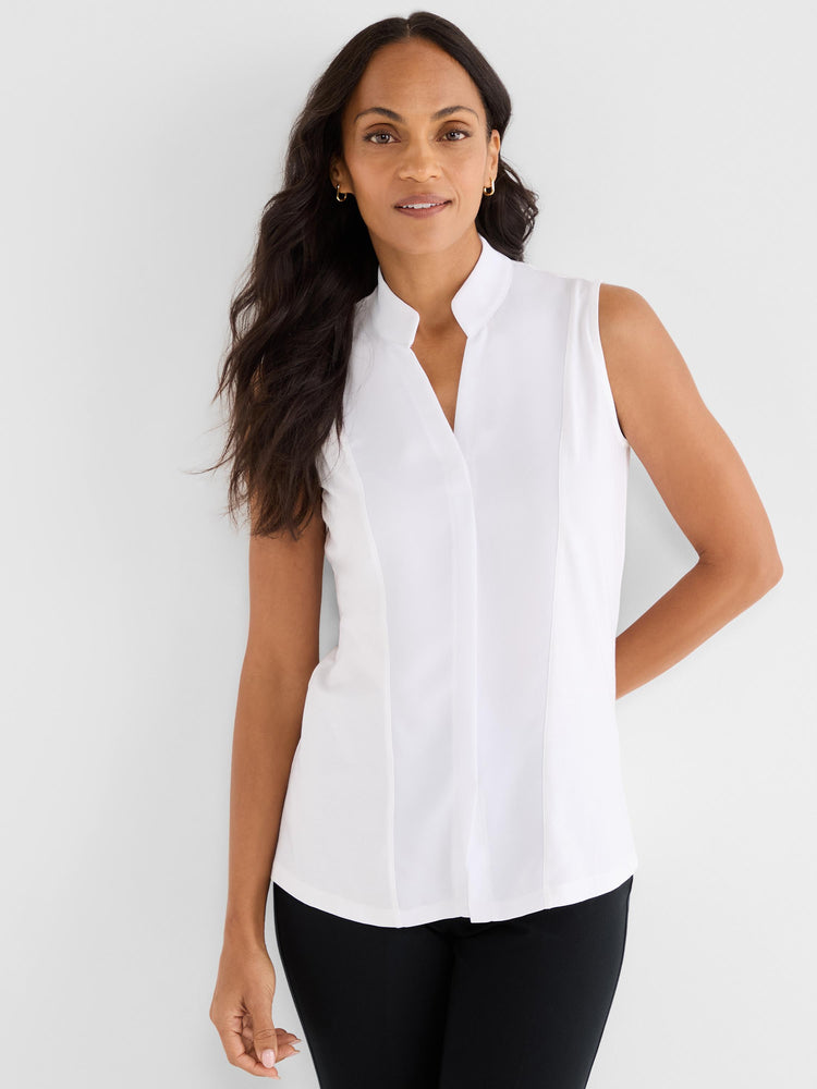 A model wears a white sleeveless blouse featuring a mandarin collar and a clean V-neck opening with tailored princess seams.