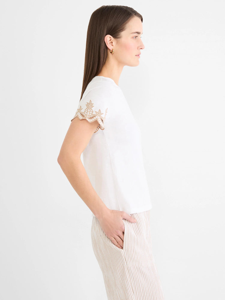 White cotton slub tee with short sleeves featuring light brown intricate embroidery.