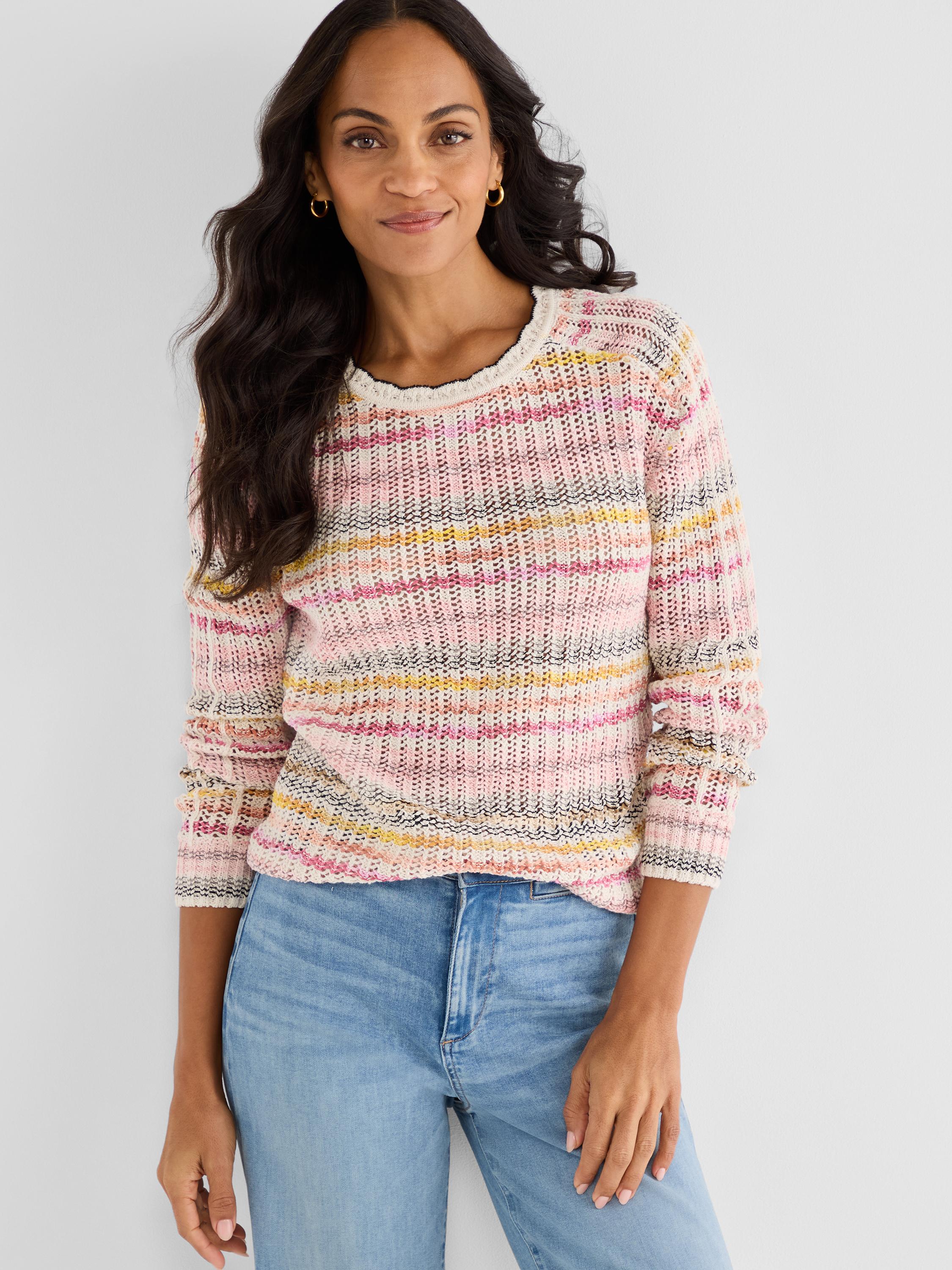 Relaxed fit open-knit pullover in pink and multicolor stripes features a scalloped neck and ruffled three-quarter sleeves.