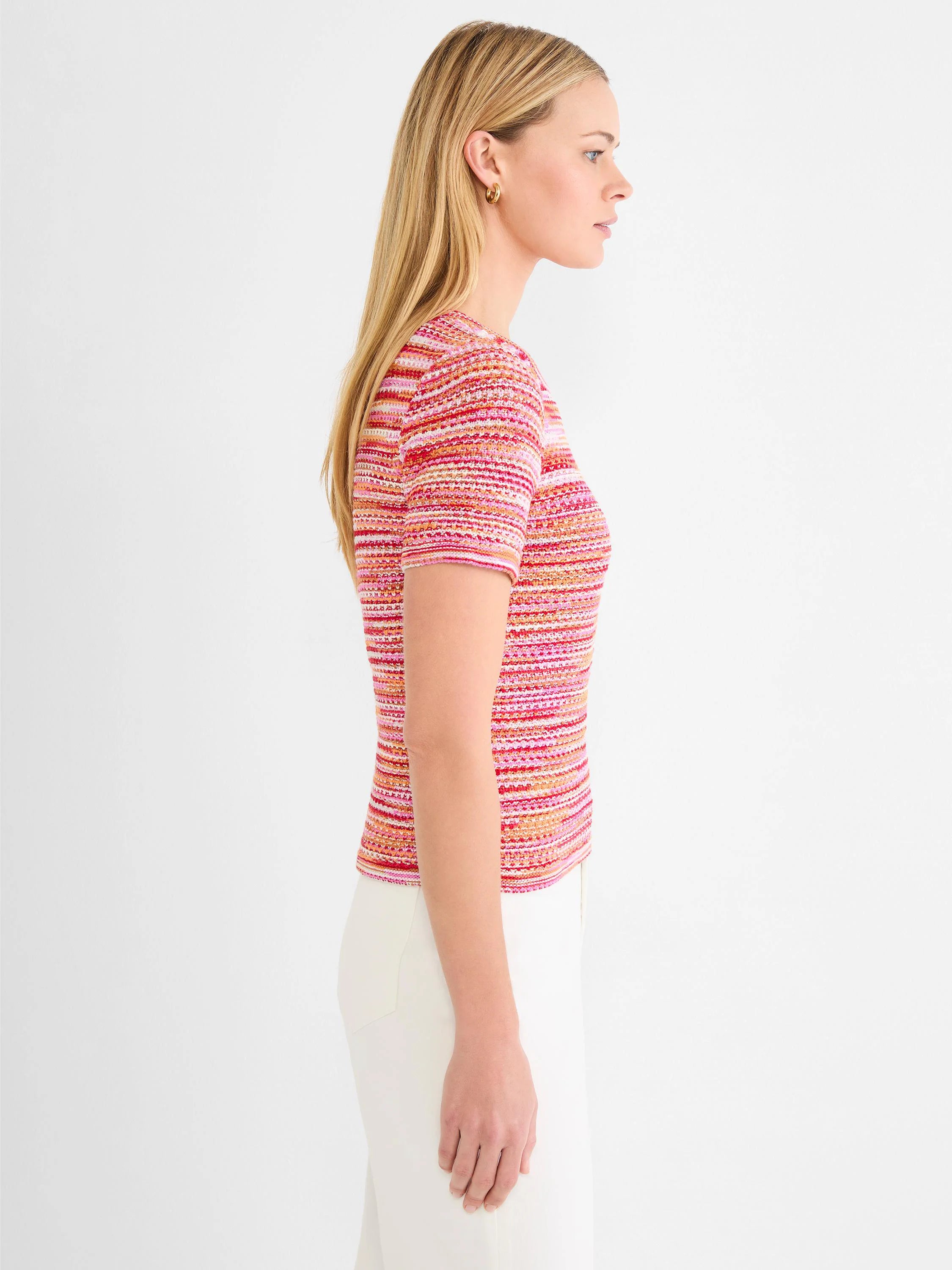 Short-sleeve sweater tee with horizontal stripes in bright pink, red, orange, and off-white spacedye knit.