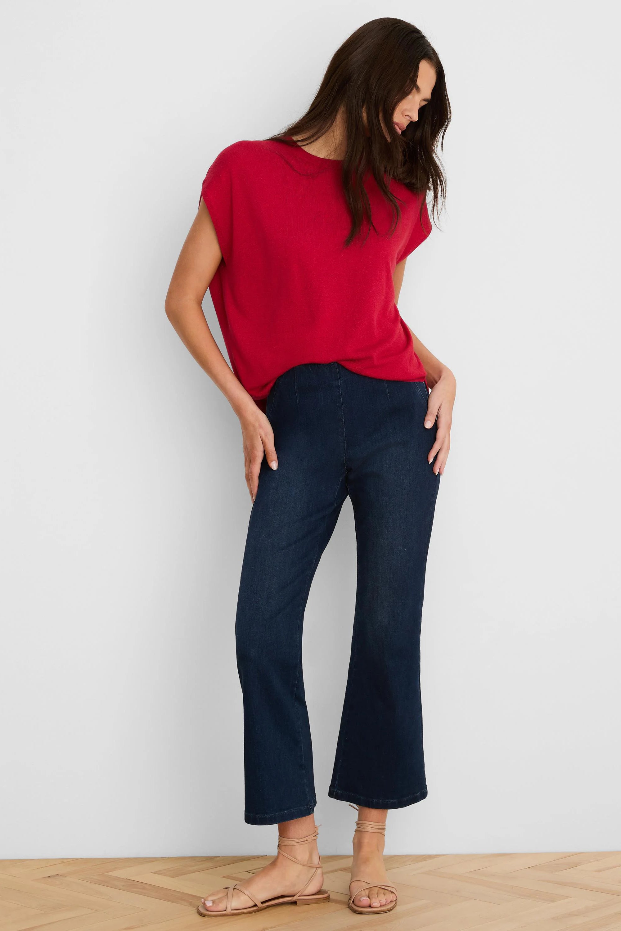 Red, loose-fit, round neck sweater with short sleeves.