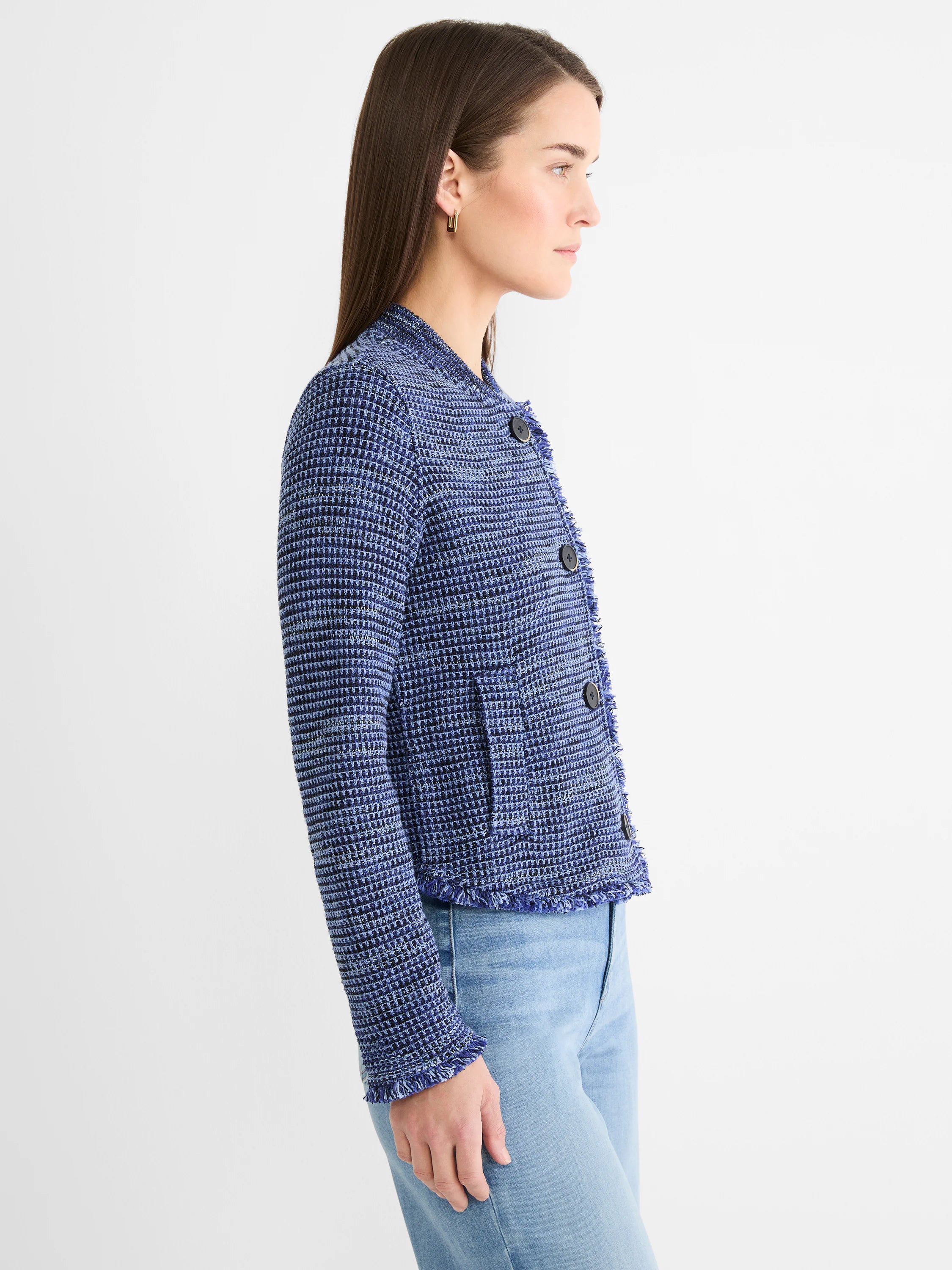 Navy and light blue knit bomber jacket with fringe on edges, three dark front buttons, and patch pockets.