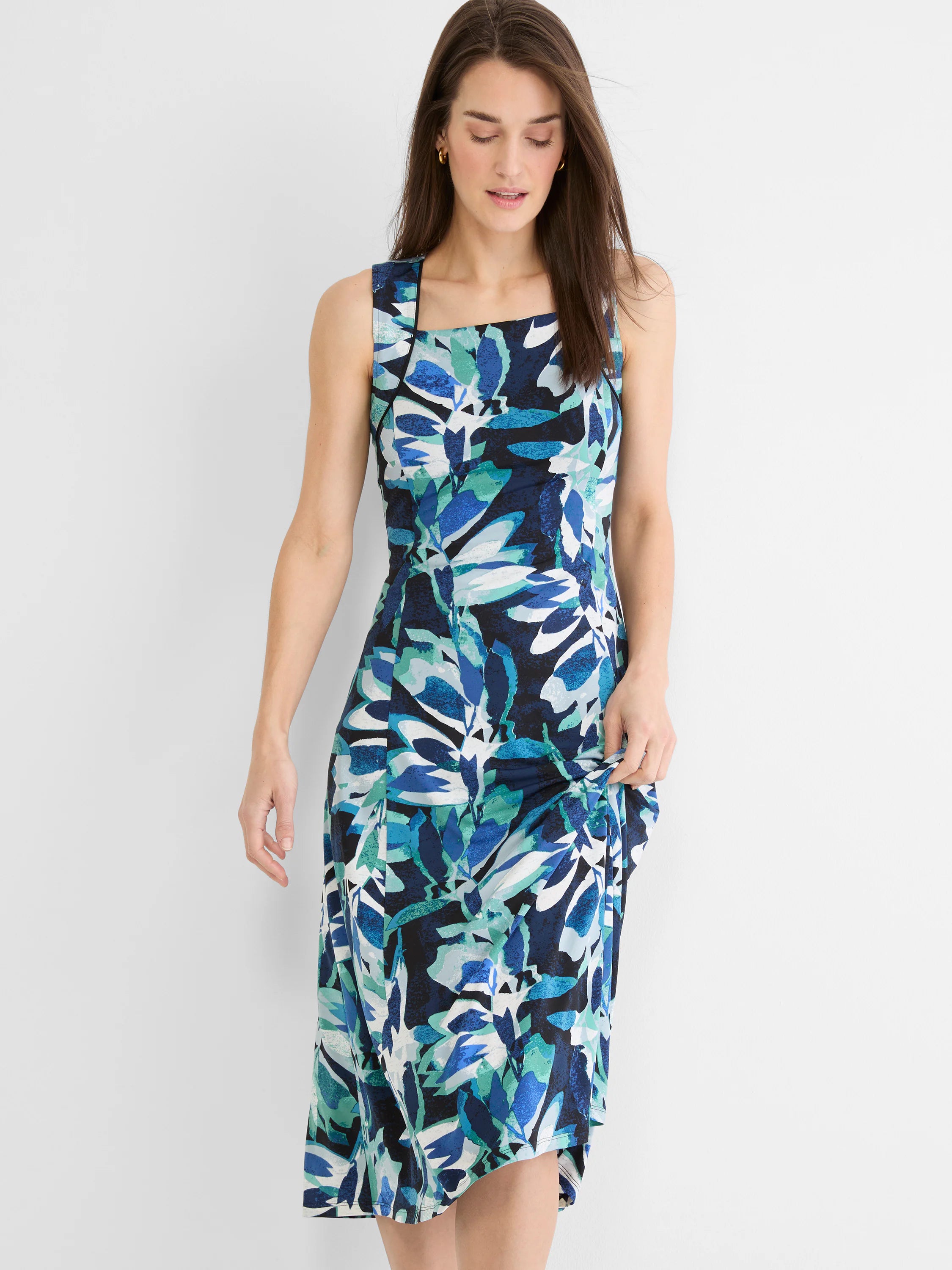 Knit midi dress with square neck. Blue, teal, navy, white leaf print.