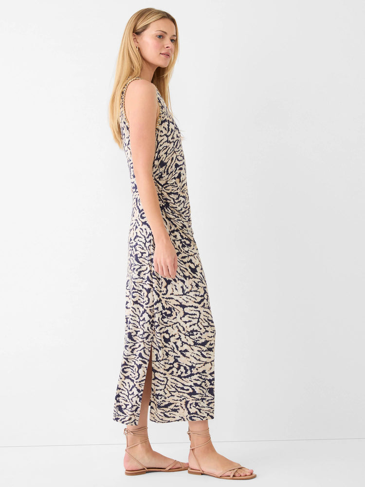 Sleeveless maxi dress with dark blue and beige abstract swirl pattern, featuring a side slit.