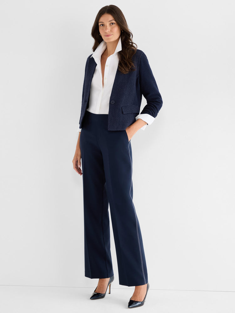 Navy textured cropped blazer and high-waist wide-leg pants feature contrasting white side stitching.