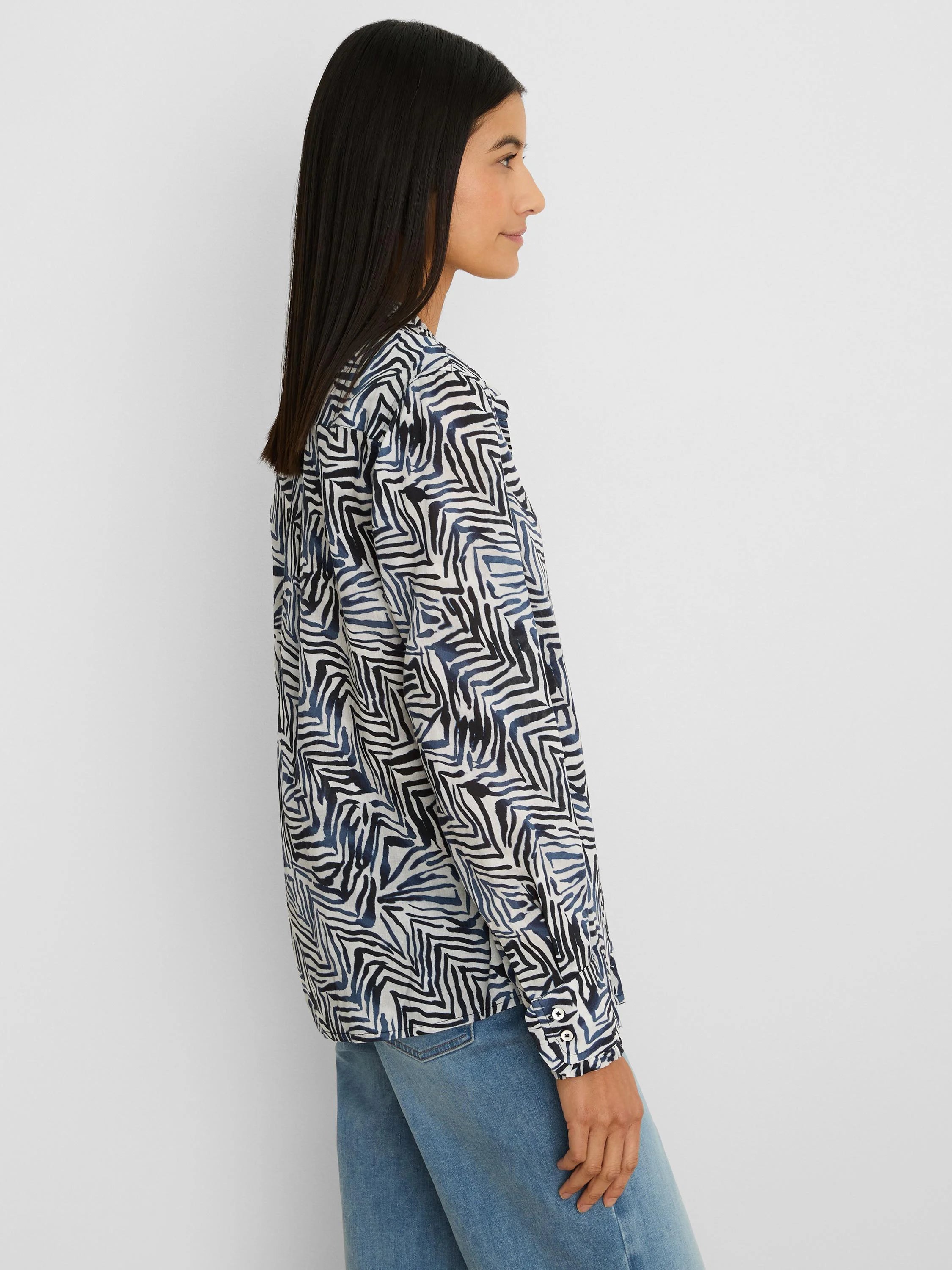 Off-white long-sleeve shirt with jagged black and dark blue line pattern.